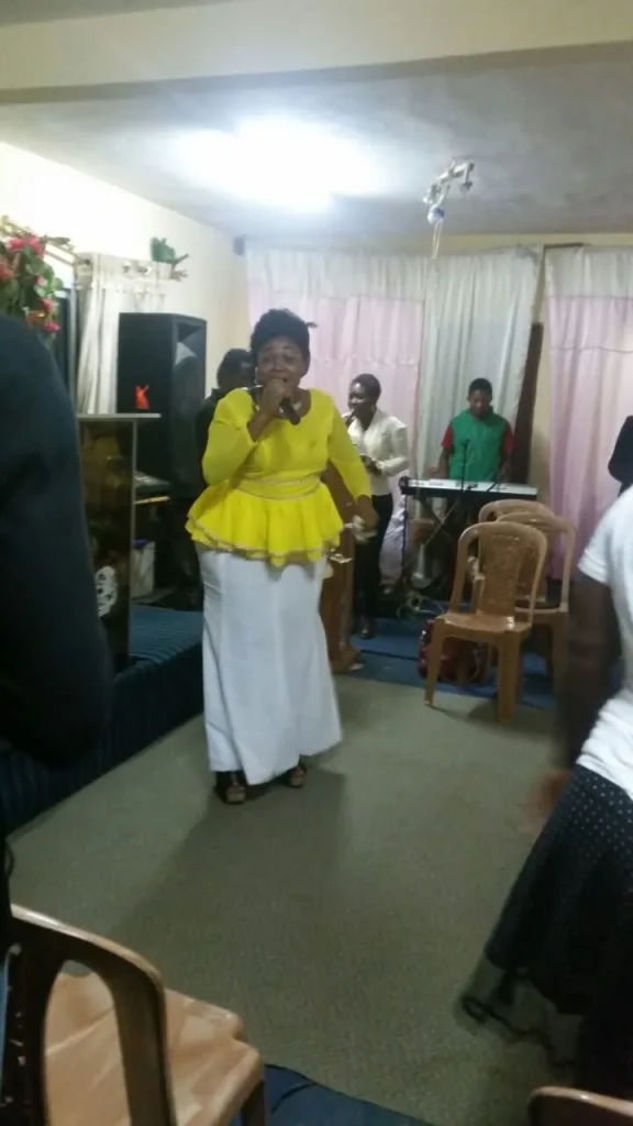 Worshippers with hands lifted in praise