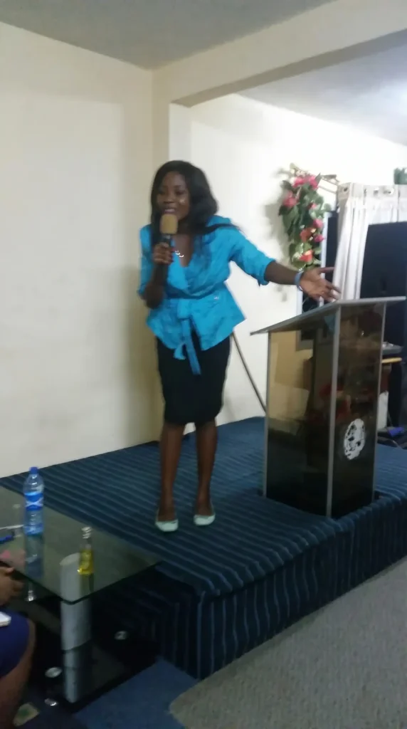 Vanessa Musenja speaking to the gathering